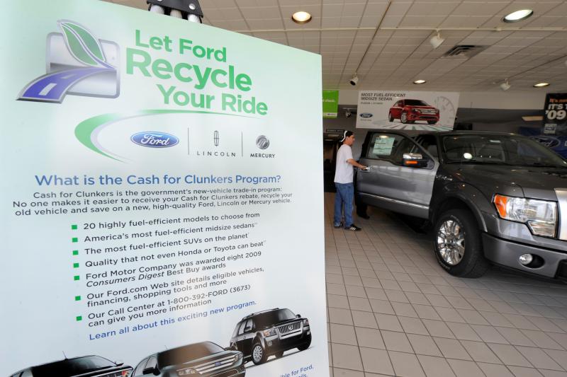 A potential customer examines the interior of a Ford truck