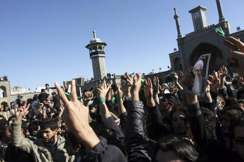 Supporters of the Iranian opposition movement wear green in the holy city of Qom, December 2009.