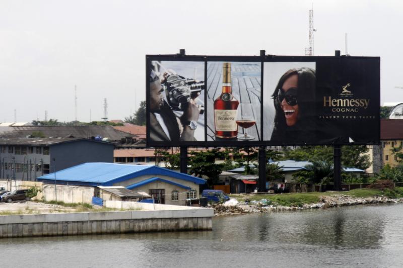 A billboard advertising Hennessy cognac near the lagoon in Ikoyi district in Lagos, June 2013.