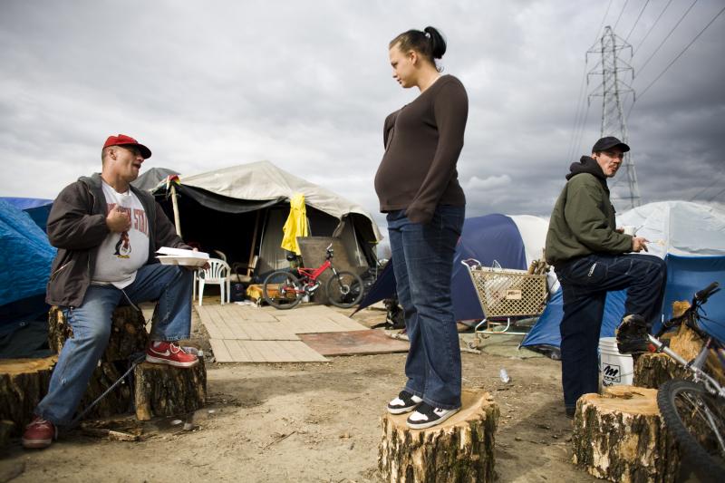 In a tent city, outside Sacramento, CA, March 2009.