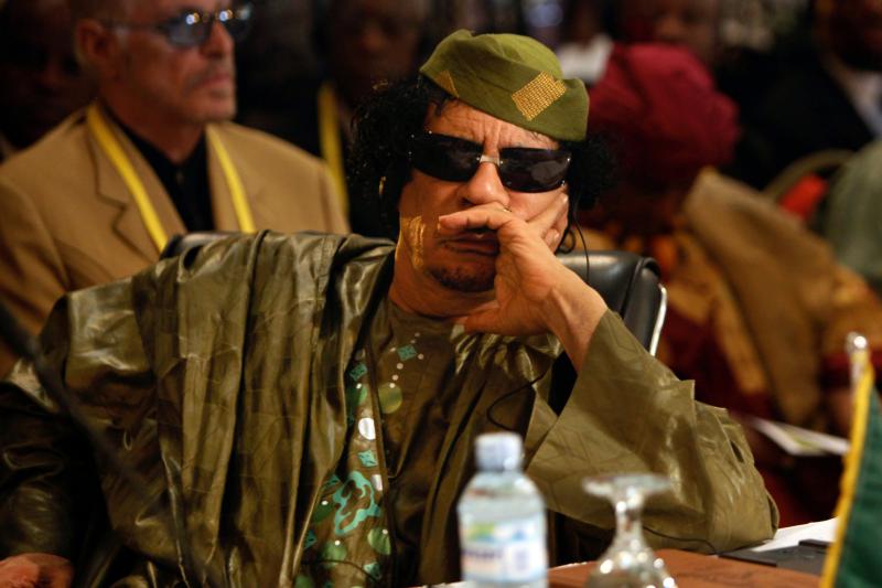 Qaddafi attends the opening of the African Union summit at the Commonwealth Resort in Munyonyo, near Uganda&#039;s capital Kampala, July 2010.