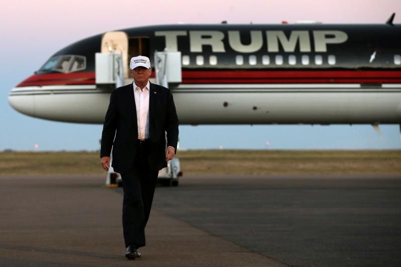 Trump walks off his plane at a campaign rally in Colorado Springs, Colorado, September 2016.