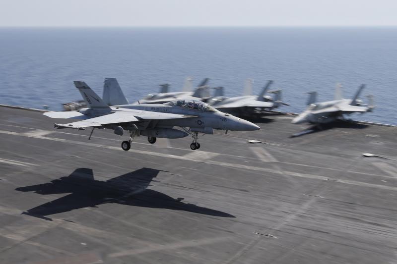 A F/A-18E/F Super Hornet landing on an U.S. aircraft carrier in Bahrain, June 2015