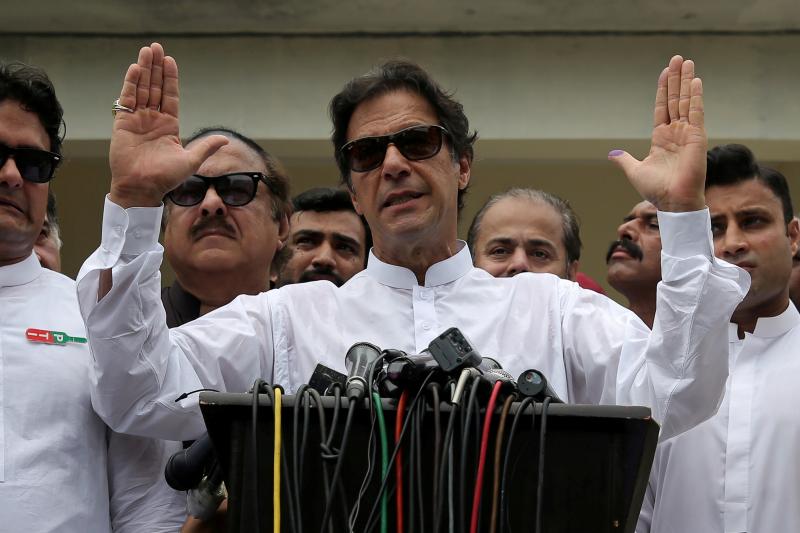 Prime Minister of Pakistan Imran Khan speaks to members of the media after casting his vote during the general election in Islamabad, Pakistan, July 2018