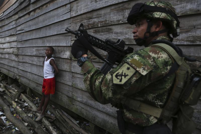 A Colombian Special Forces soldier patrols a street in Buenaventura, March 2014