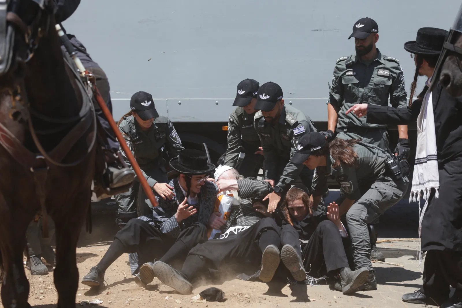 Israeli police clashing with ultra-Orthodox protesters at a military recruitment center in Ramat Gan, Israel, August 2024 