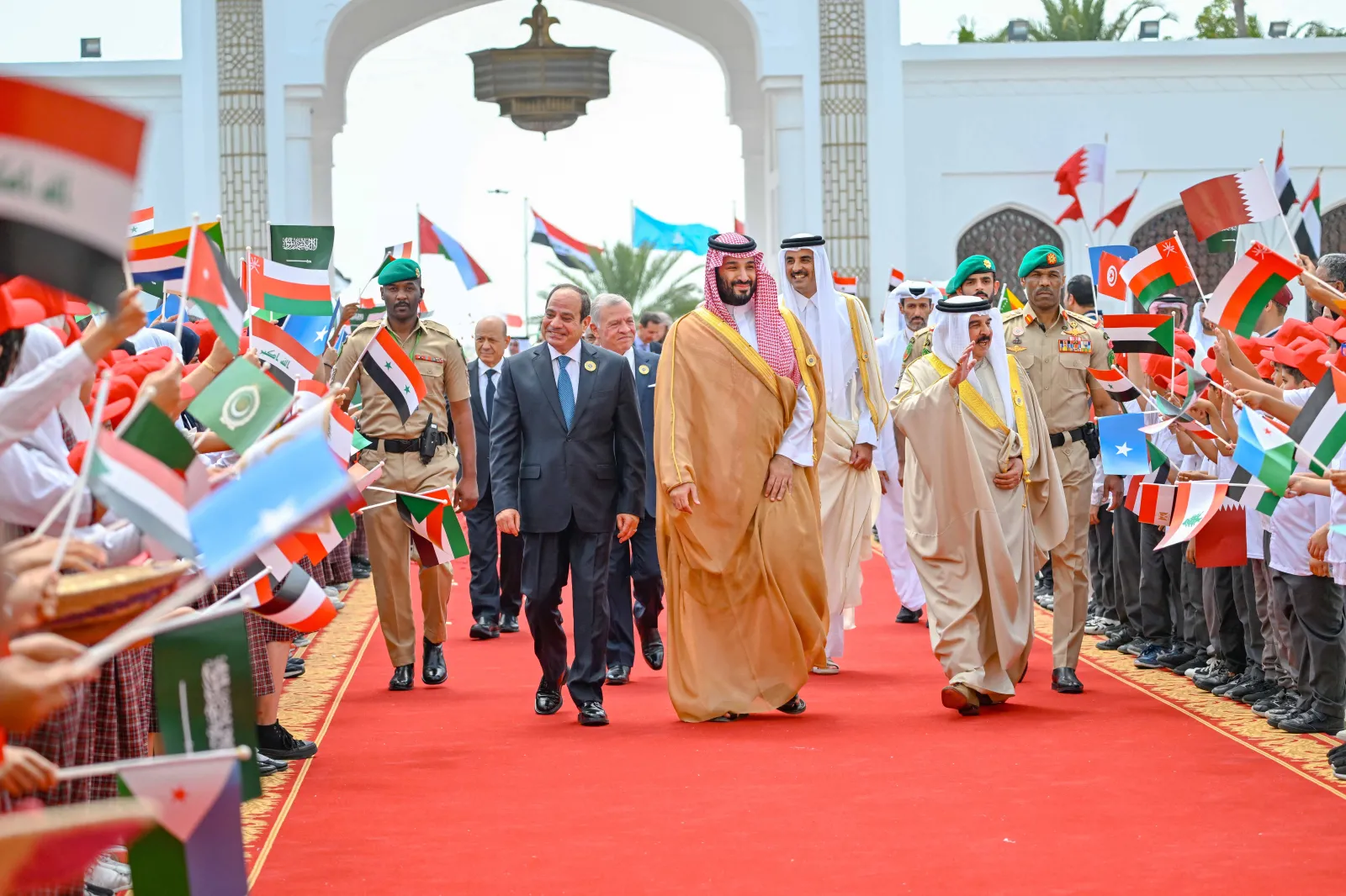 Bahrain King Sheikh Hamad bin Isa al-Khalifa, MBS, and Egyptian President Abdel Fattah el-Sisi walking in Sakhir, Bahrain, May 2024